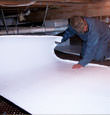 Marshalltown insulation being installed in a crawl space.