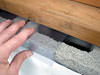 Clear plastic vapor barrier covering for block walls in Osceola