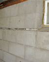 Severely buckling foundation walls in a home in Knoxville in need of repairs.