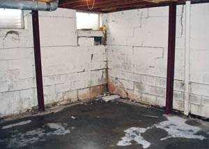 A failed, rusty i-beam foundation wall system installed in Hampton.