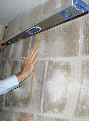 severe foundation wall failure symptoms of a basement wall in Adel