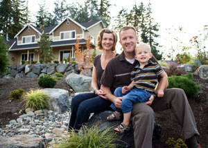 A happy family outside a home with a repaired foundation in Jefferson