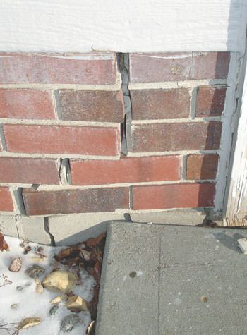 Severe street creep damage to a garage wall outside a Albia home
