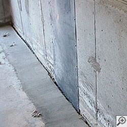 an ugly basement weeping tile drainage system that's clogged and not working in Urbandale.