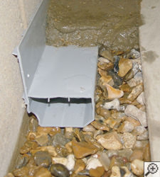 A no-clog basement french drain system installed in Fort Dodge